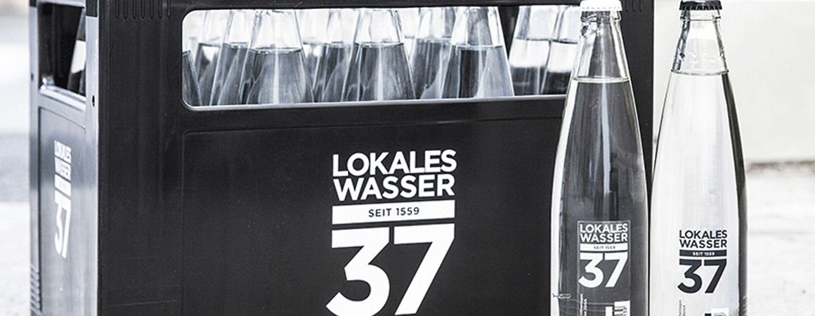 Advancing the Reuse of Glass Containers: Premium Wash-Off Labeling for a Premium Water Brand